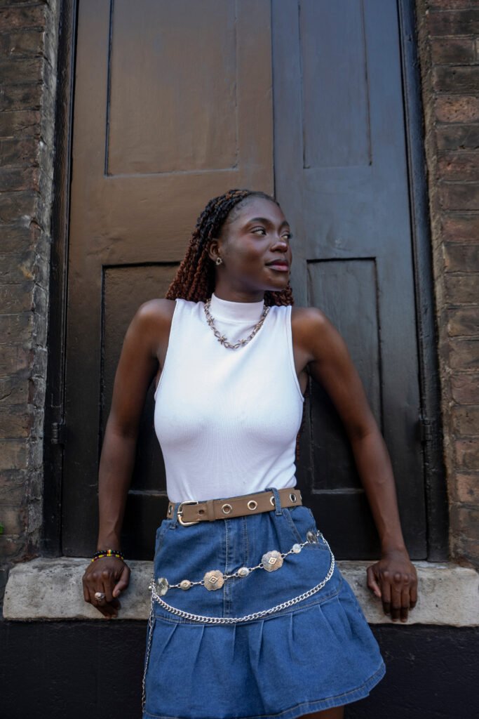 Woman wearing white top and mini skirt
