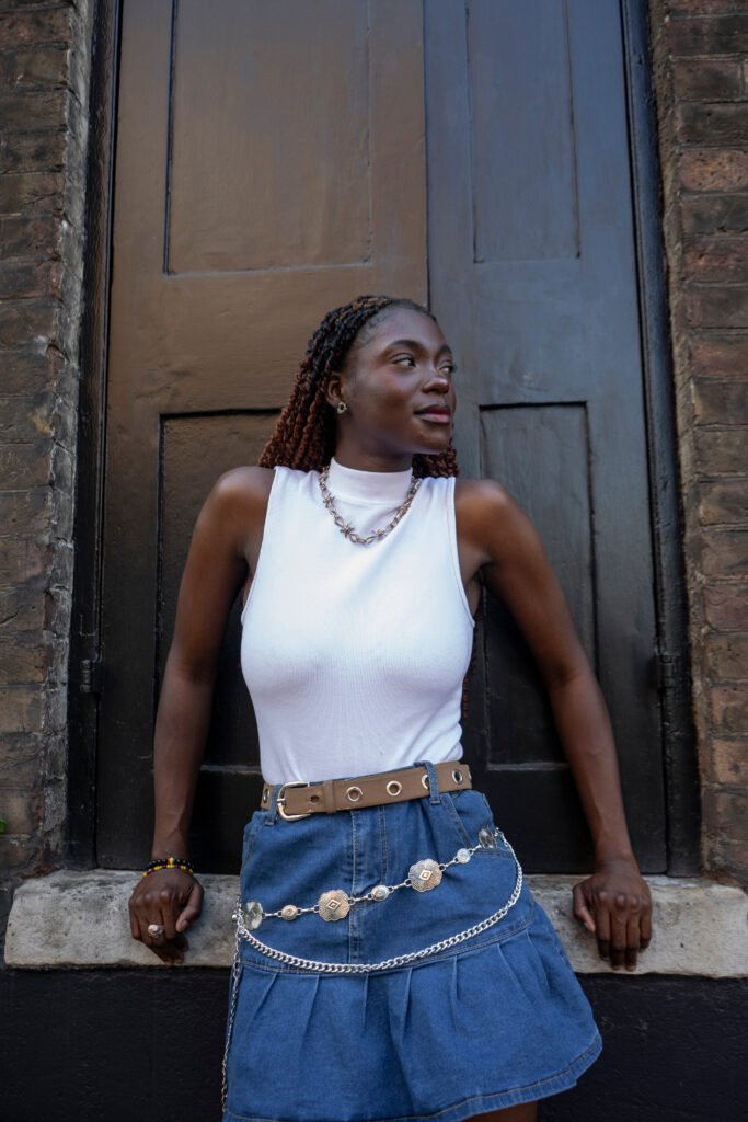 Woman wearing white top and mini skirt